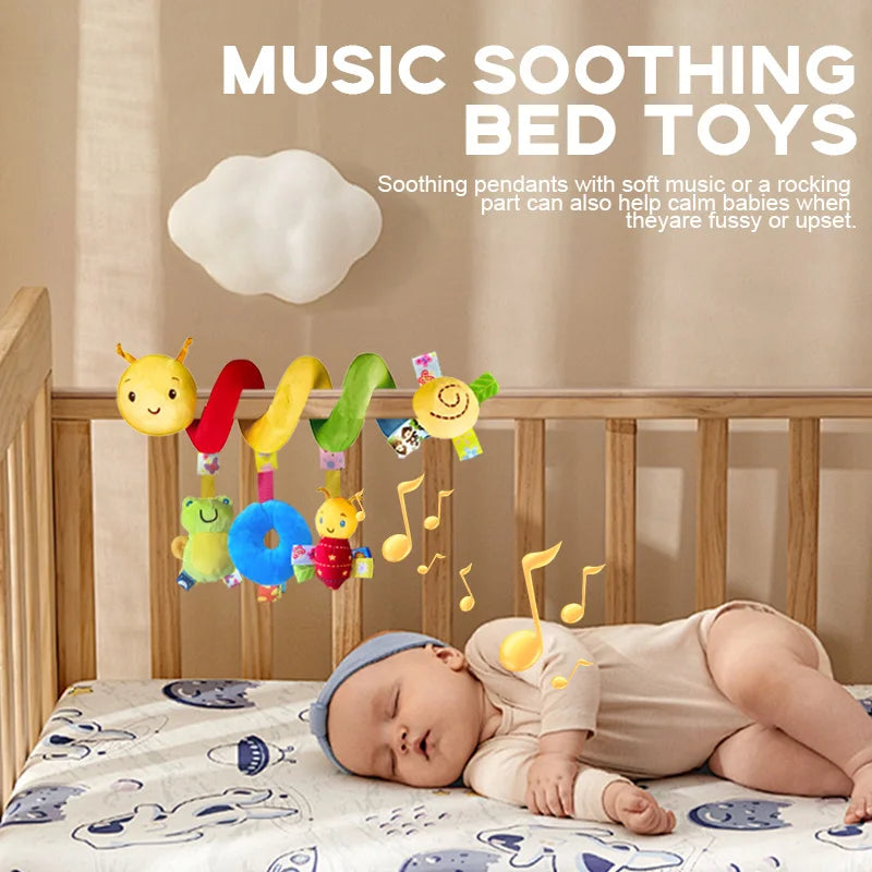Baby lying in a crib with colorful music soothing bed toys above.